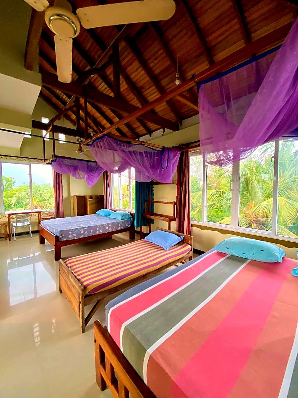 Bed in the bright 6-bed mixed dorm