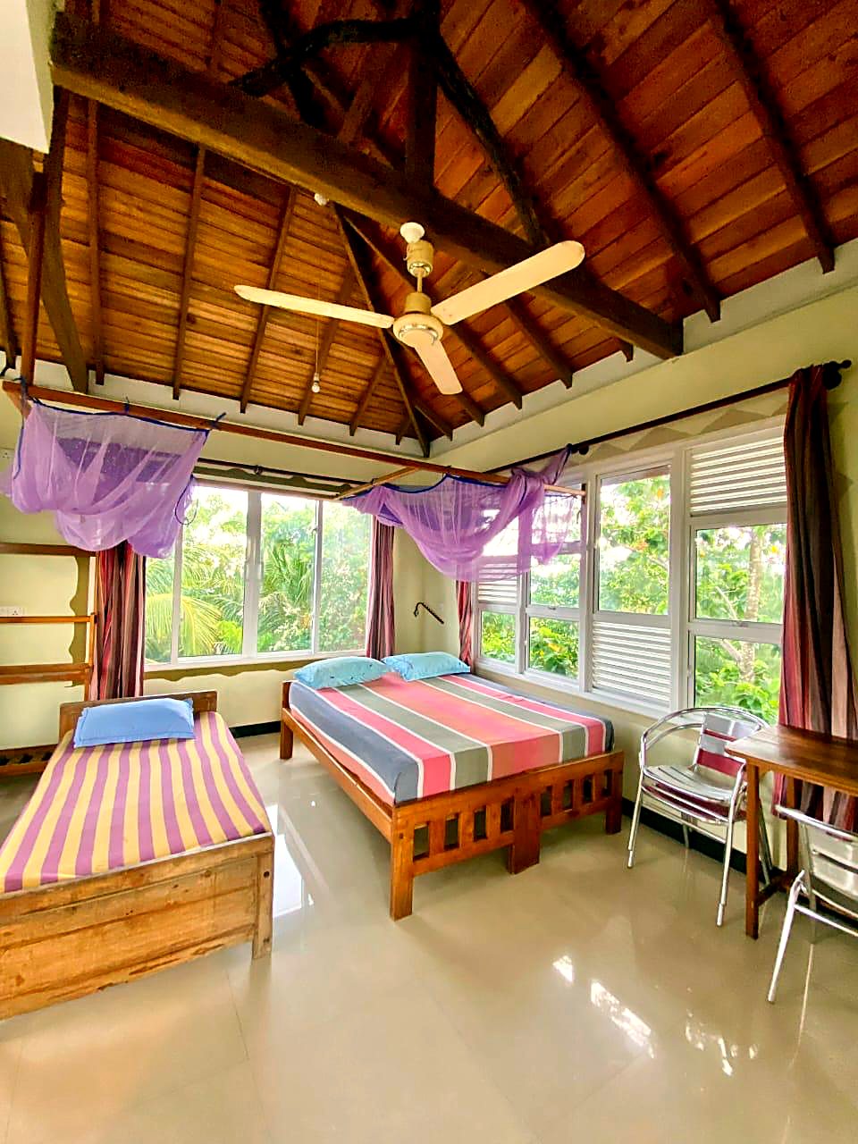 Canopy room with twin beds and jungle view