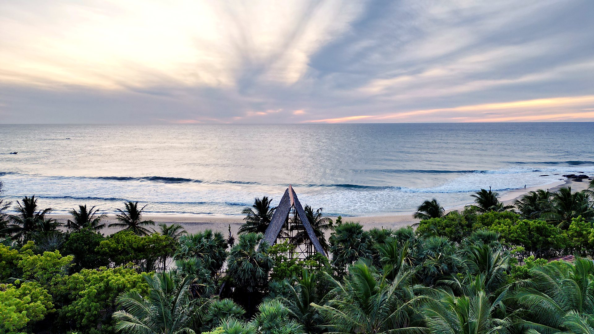Aerial of Light House Surf Camp in the palm jungle by the sea